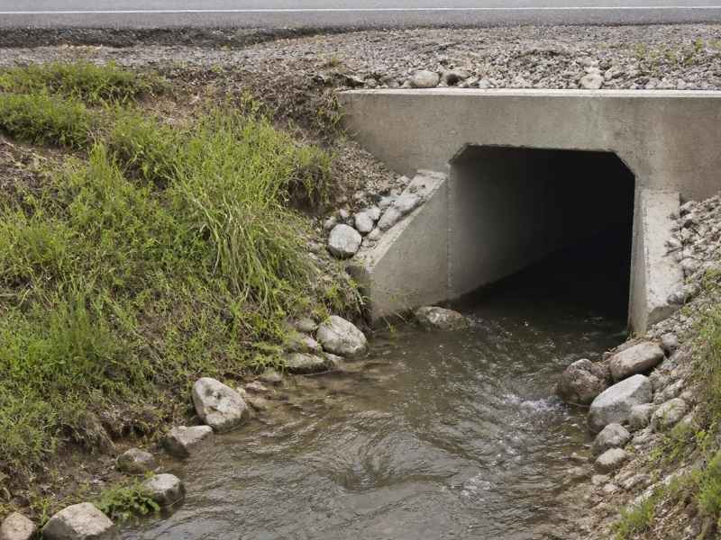 Flood study existing culvert Huntsville AL | Huntsville Civil Engineering Existing concrete culvert carrying stormwater beneath a roadway in Huntsville, AL, relevant to flood study planning and drainage evaluation.
